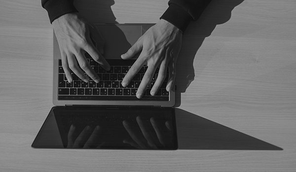 Somone of the Securing Society team working on a laptop